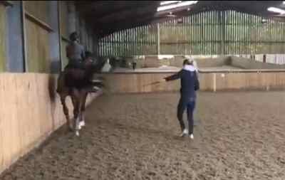 Dujardin seen whipping a horse